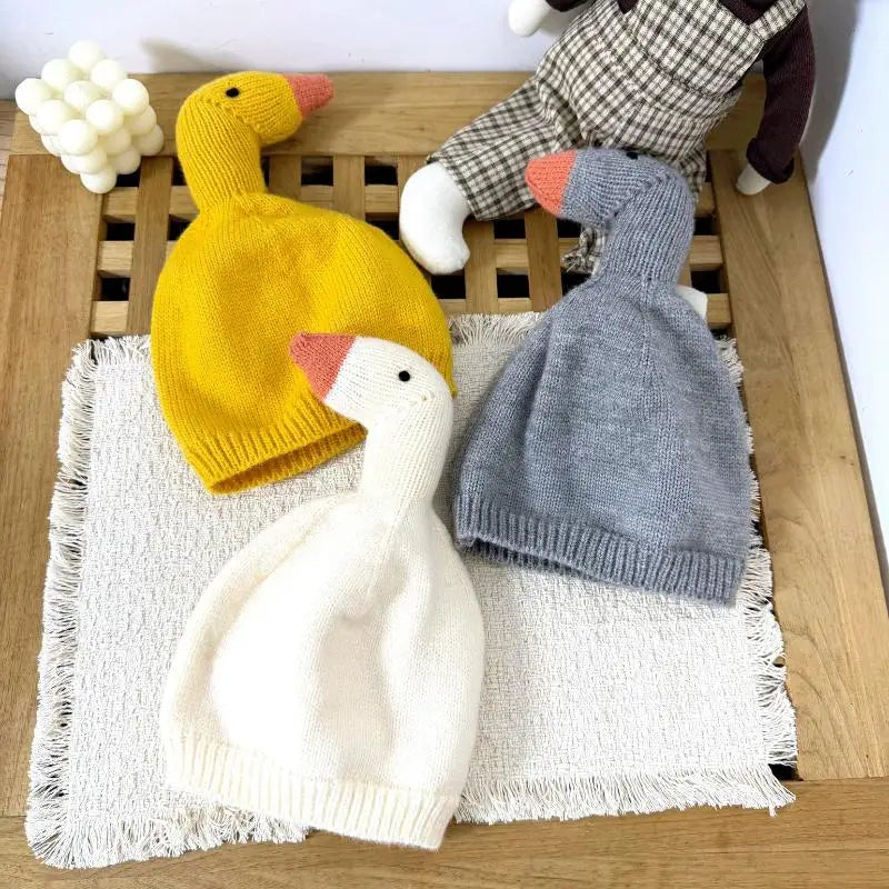 Duck knit beanies in yellow, white and grey