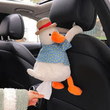 Plush duck tissue holder hanging on a car headrest